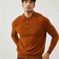 Man wearing a sapphire blue cashmere pullover sweater with a polo collar in a loose fit.