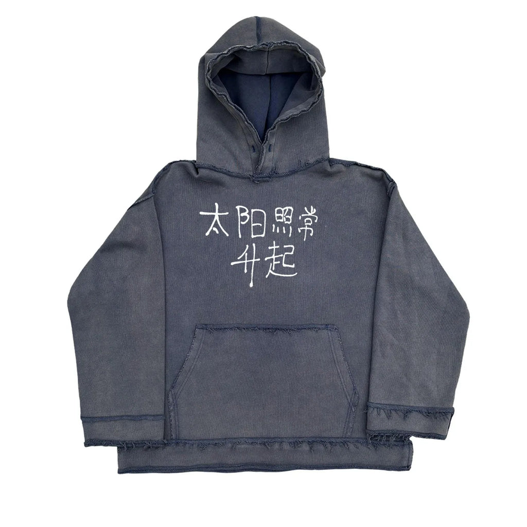 Dark blue hooded sweatshirt with a graphic design on the back, shown in a casual setting.