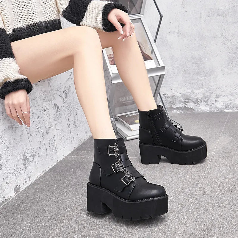 Black women's punk style Martin boots with bat buckle and side zip closure