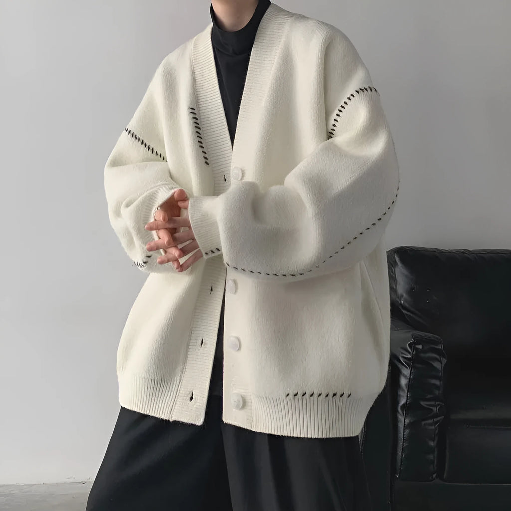 Women's long sleeve loose fit knitted cardigan coat in solid black or white colour.