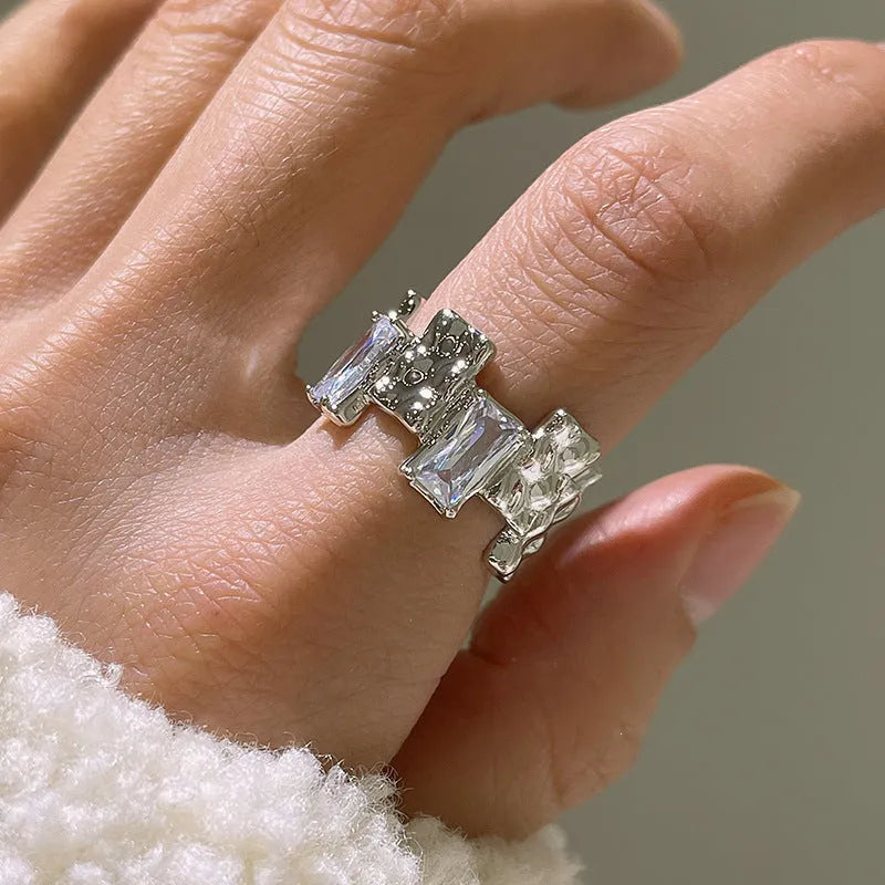 Silver geometric cross zircon ring with open gemstone design and three-dimensional decoration
