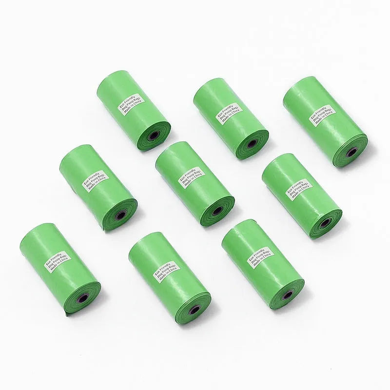 Rolls of green, black, blue, purple, and orange EPI degradable pet poo bags with a plastic dispenser.