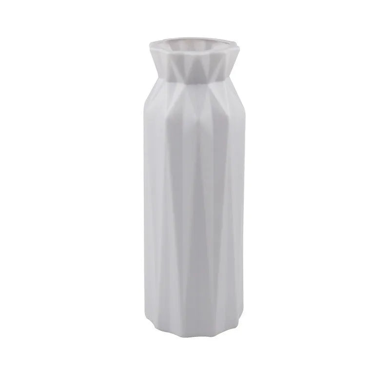 Green melamine plastic vase with a wide 7.2cm base on a wooden table.