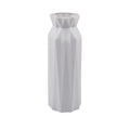 Green melamine plastic vase with a wide 7.2cm base on a wooden table.