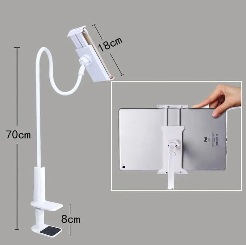Black bedside oversize flat panel phone holder with a long arm mounted on a table.