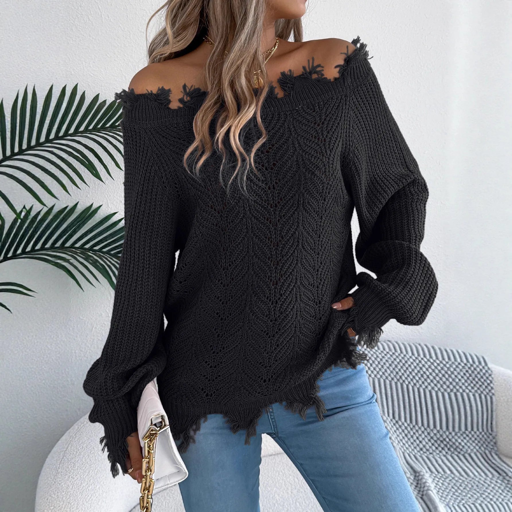 Women's white cut off-the-shoulder pullover sweater with hollow-out design and long sleeves