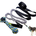 Green cotton rope dog toy with ball for tug of war and fetch games.