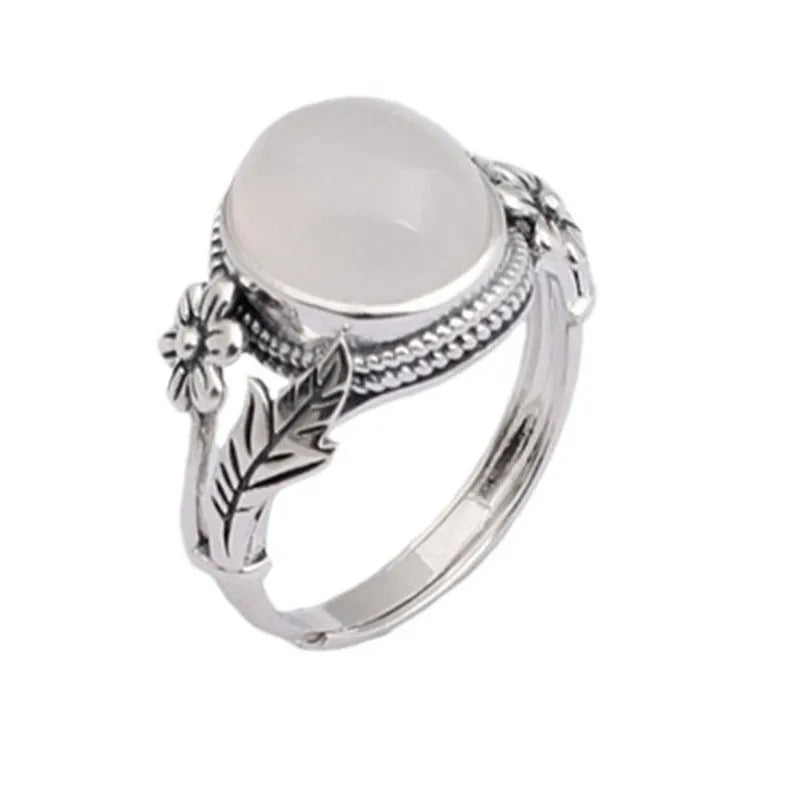 Adjustable copper U-shaped vintage ring with a white chalcedony effect finish.
