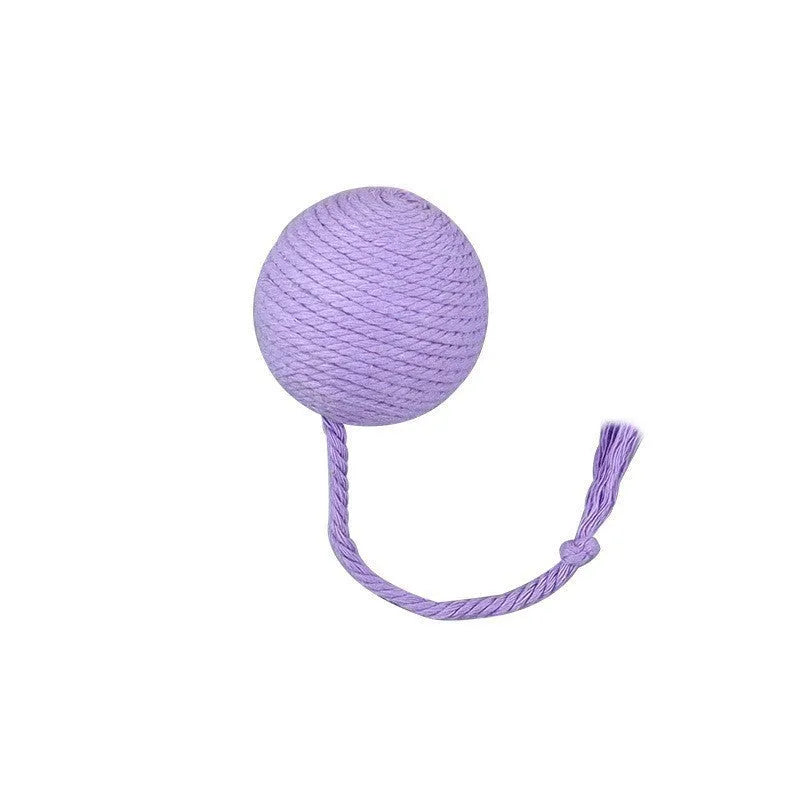 Green cat toy ball with a rope handle looped through it, shown next to a smaller pink version.