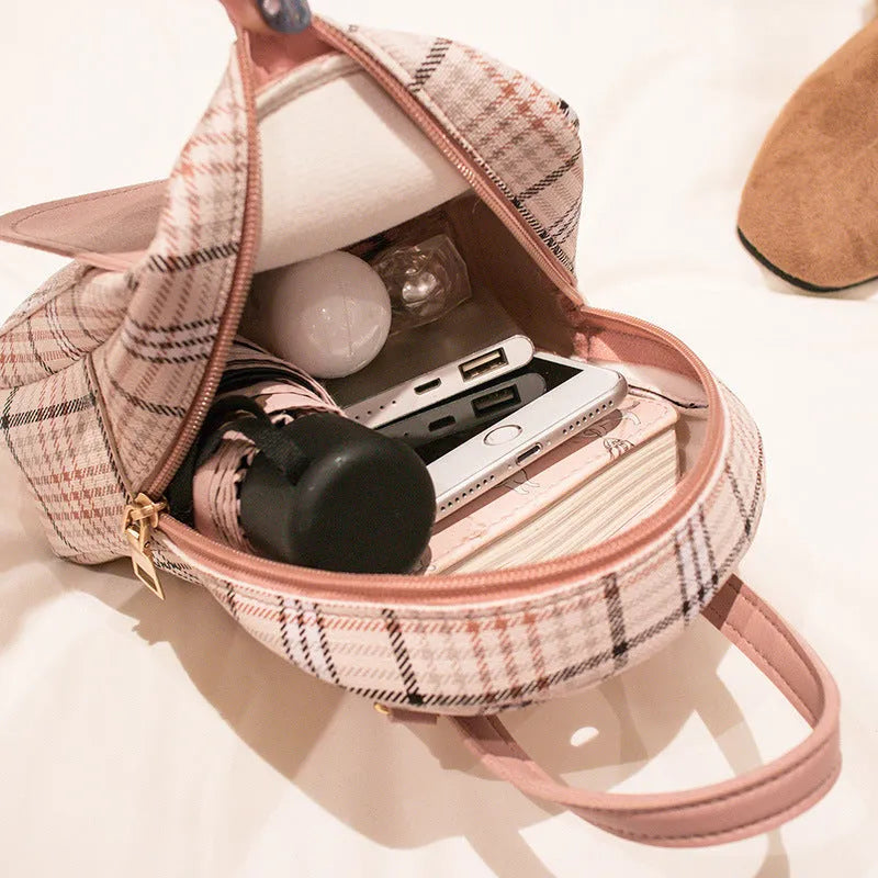 Diagonal shoulder phone bag in PU leather shown in one of five colours: black, blue, brown, pink, or red.