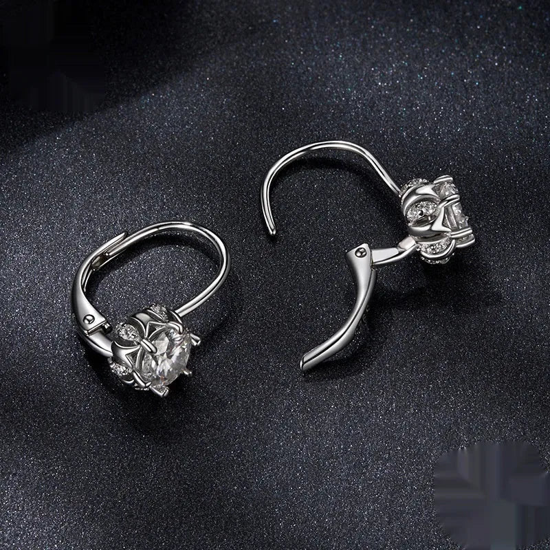 Sterling silver flower bud ear clips with white gold plating and moissanite stone