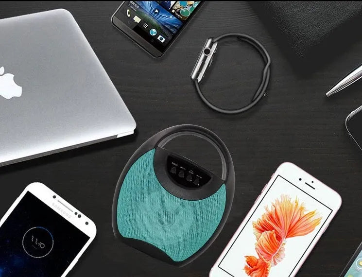 Portable Bluetooth speaker in black, blue, or pink with USB and SD card slots.