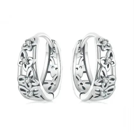 Close-up of women's retro hollow butterfly earrings made from S925 sterling silver with zircon stones.