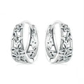Close-up of women's retro hollow butterfly earrings made from S925 sterling silver with zircon stones.