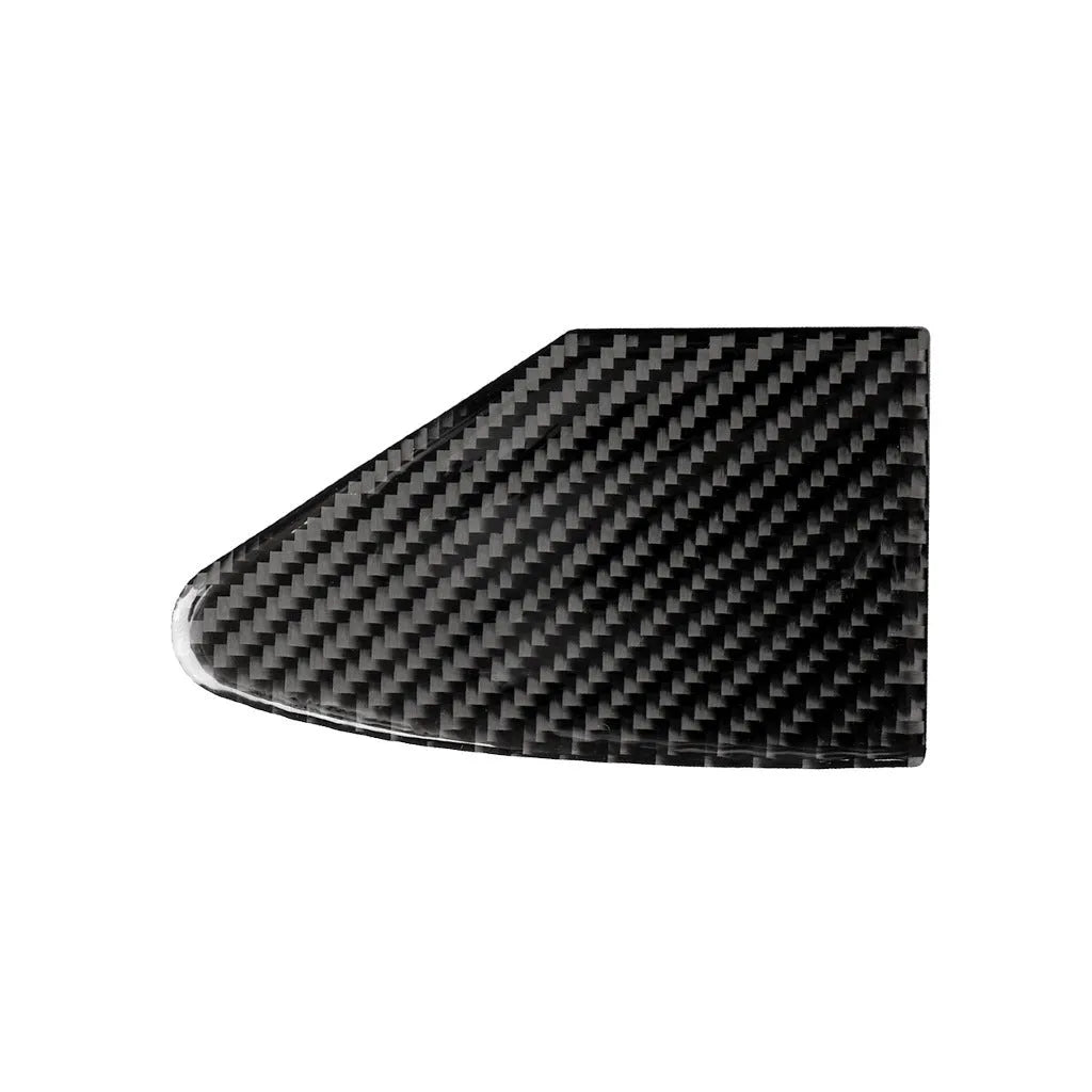 Carbon fibre textured sticker for covering a device charging port panel, showing the 3M adhesive backing.