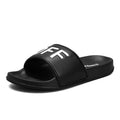 Large men's open toe slippers with a black viscose upper and rubber sole, shown on a size 46 label.