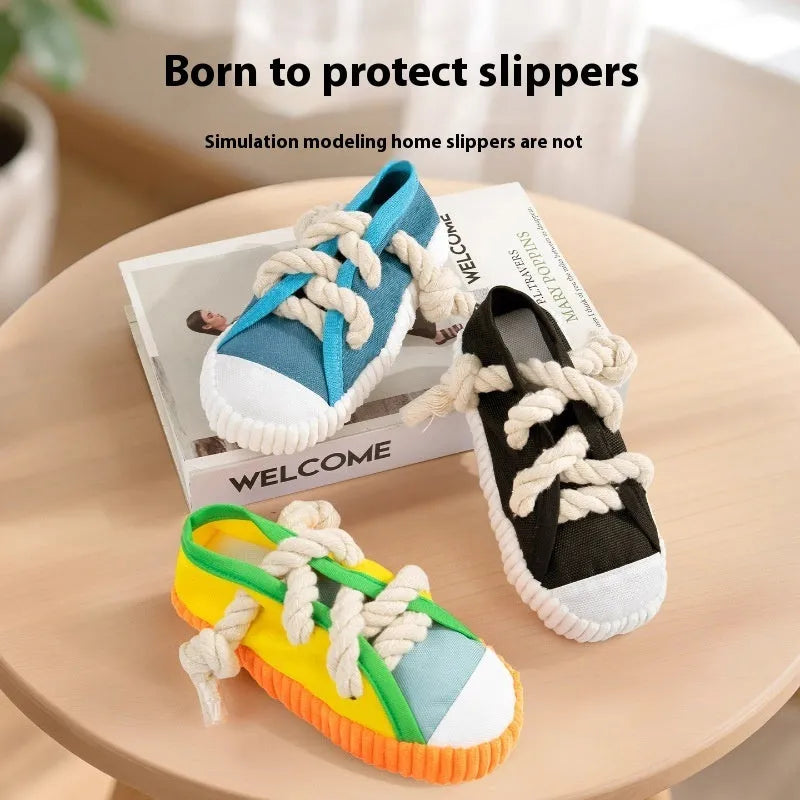 Slipper-shaped plastic dog chew toy in three colours with bends for chewing