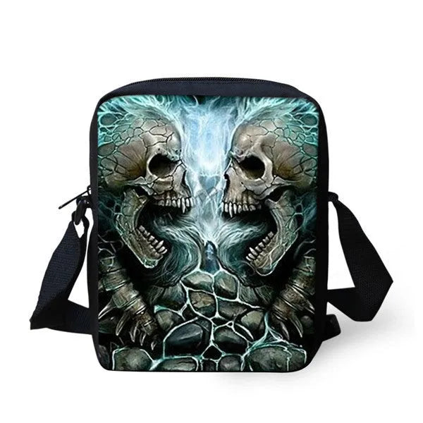 A medium-sized black children's messenger bag with a white skull graphic, showing the double straps and front zipper pocket.