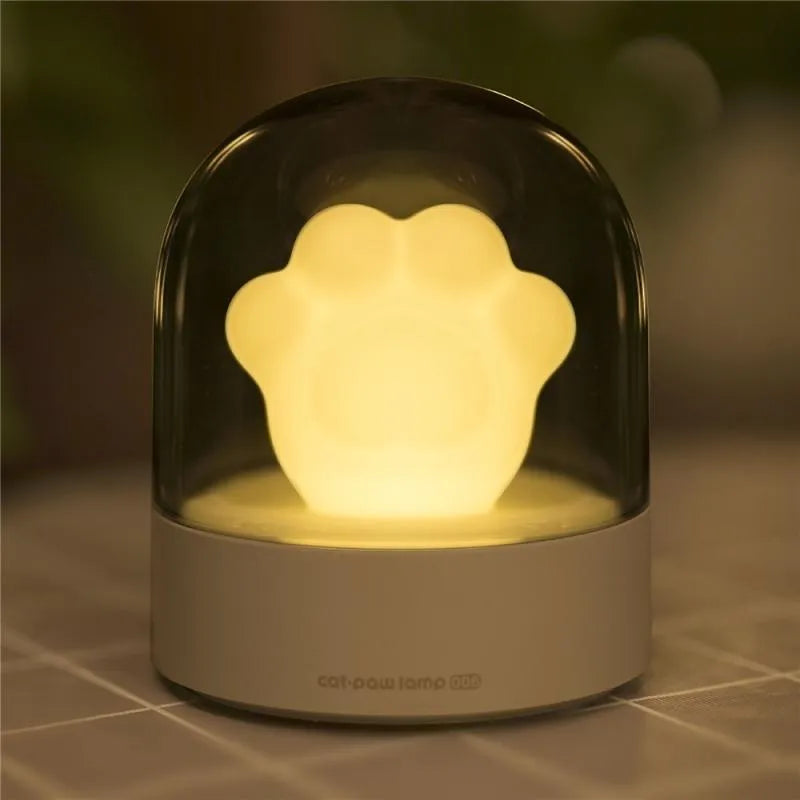 Grey and pink cat paw shaped USB rechargeable night light with musical functions