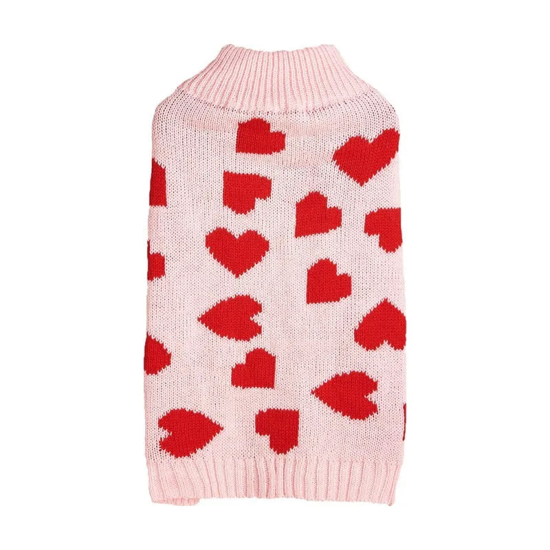 Red love heart design on a pink acrylic dog sweater for a small dog.