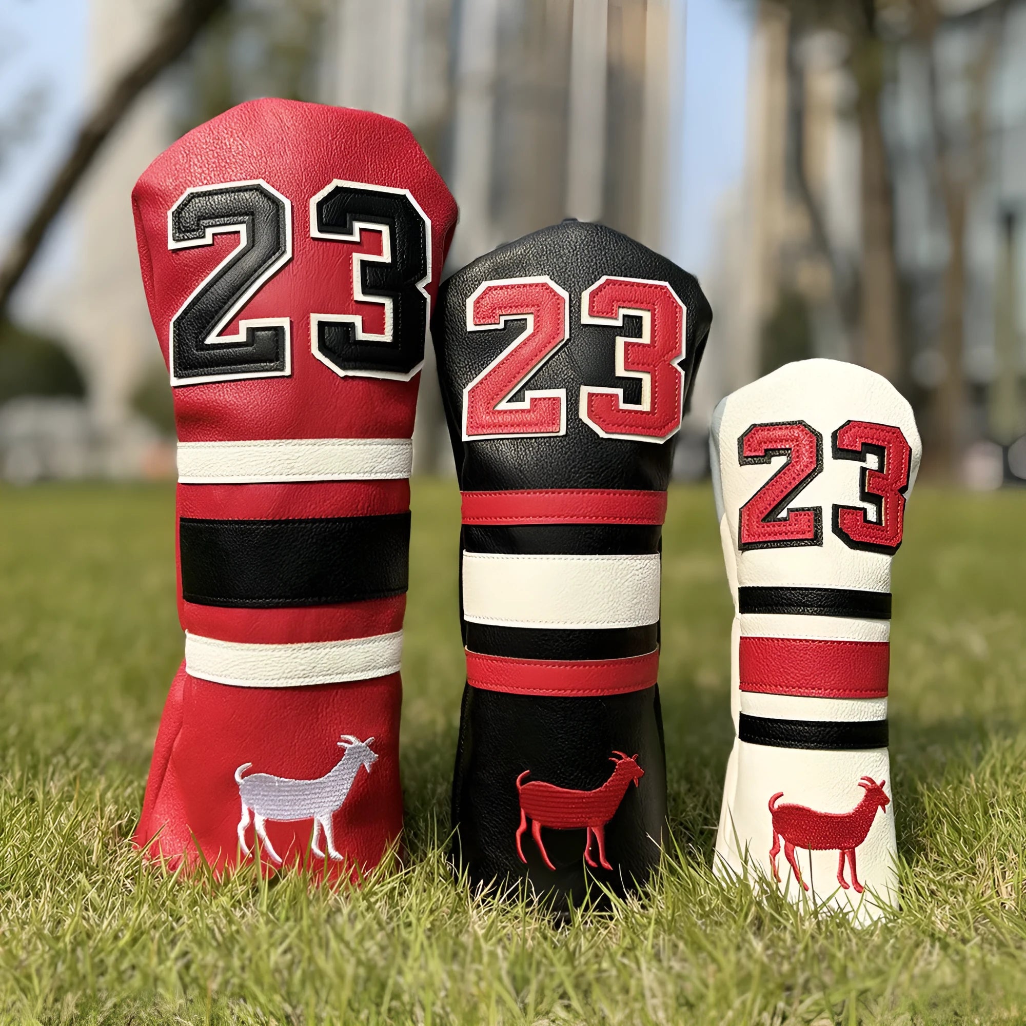 Red square putter iron head golf club sleeve covering a wooden pole set
