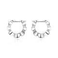 Sterling silver geometric earrings with circular elements and retro design