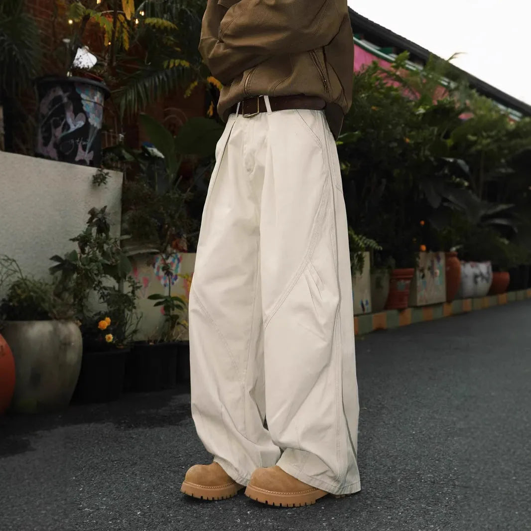 Men's pleated straight-leg trousers in loose fit showing Black, Brown and Apricot colour options