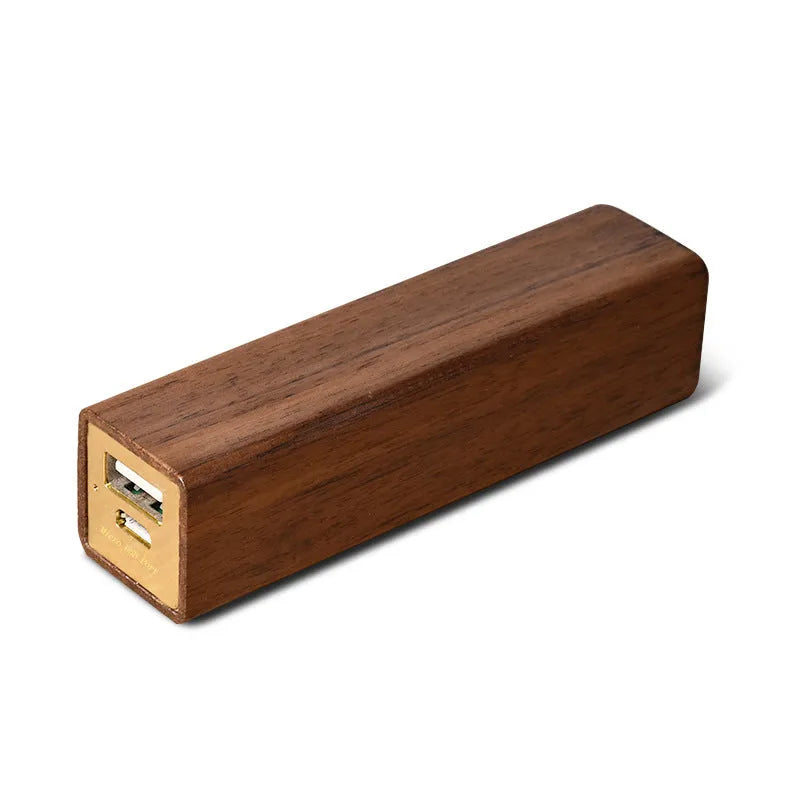 Brown walnut wood portable power bank with dimensions 100mm by 25mm.