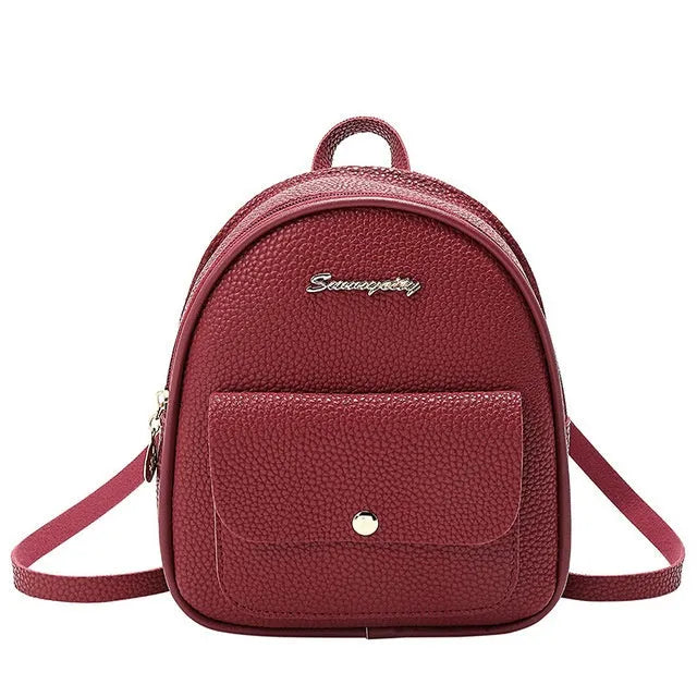 Women's small PU backpack shoulder bag in black, blue, grey, pink, or red with zipper closure