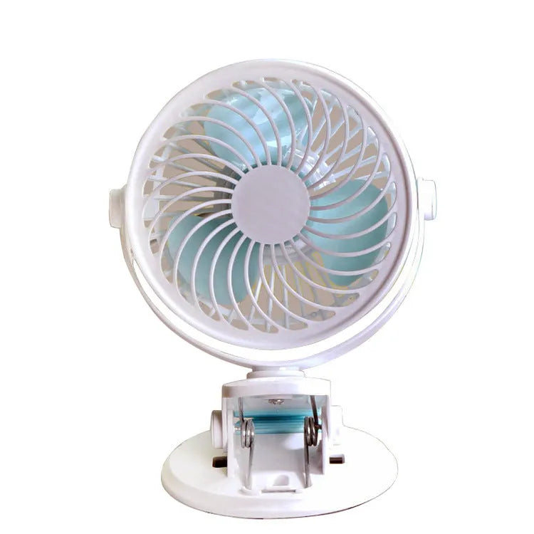 Small white USB desktop fan with clip attached to a desk edge, showing three blades.