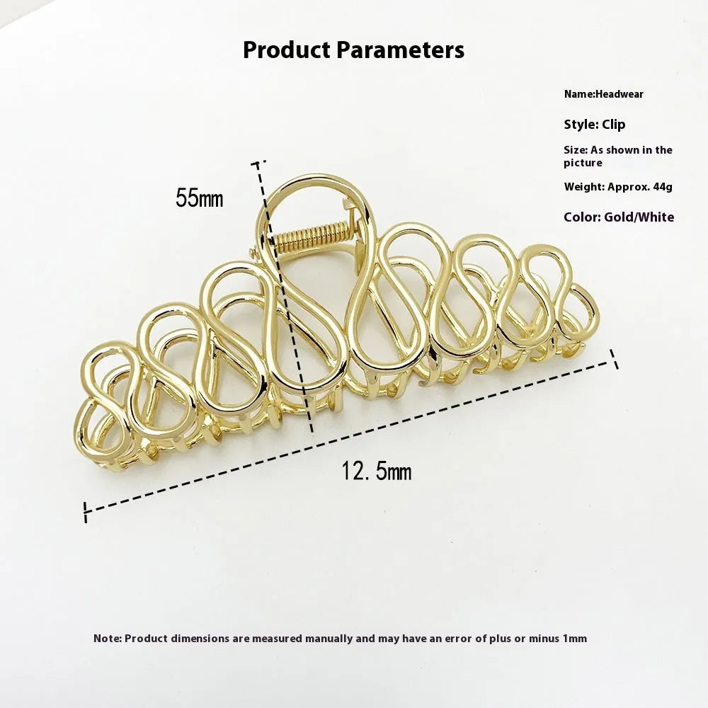Large gold and silver alloy hair clip with a minimalist design and tassel detail for updo hairstyles.