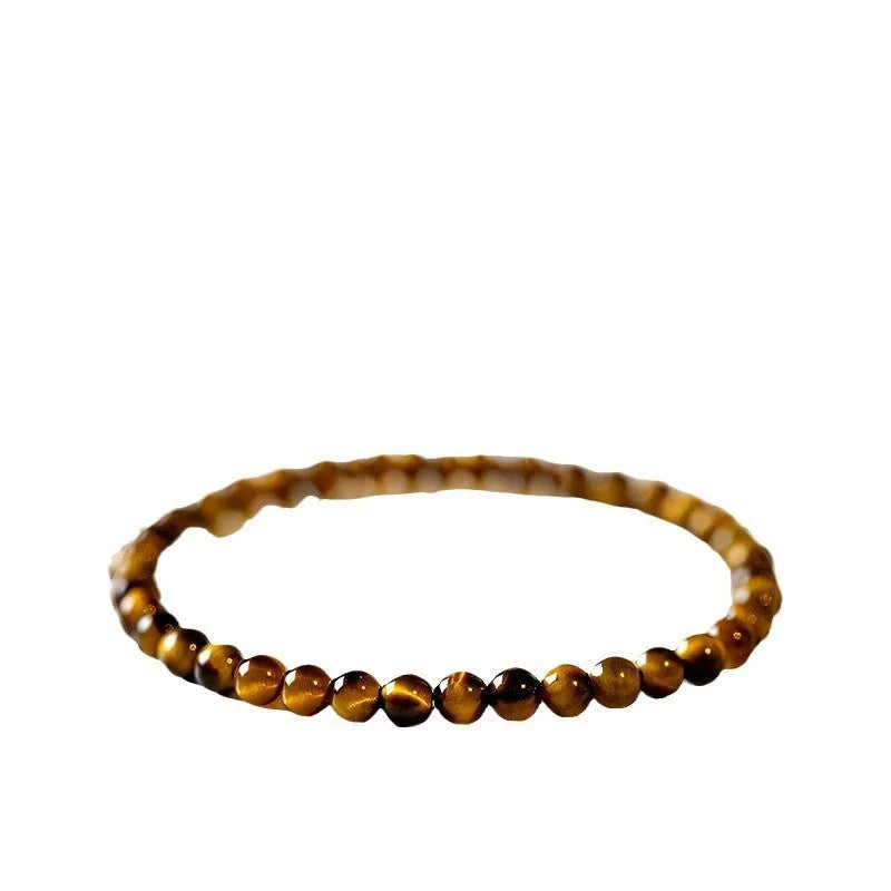 Tigereye stone bracelet with geometric Chinese style design showing round bead elements