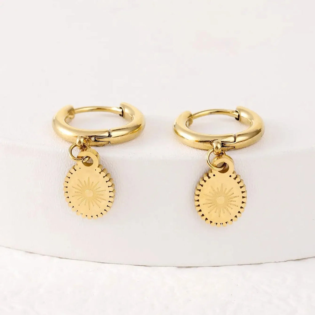 Stainless steel geometric drop earrings with oval elements and ear button fastening