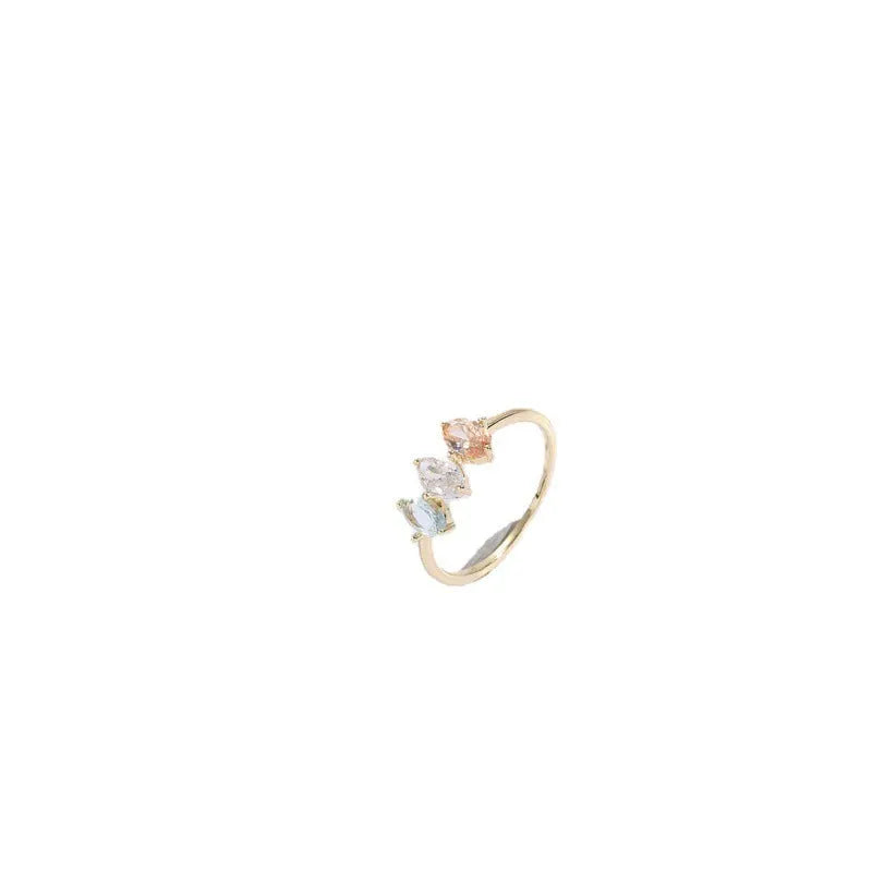 Geometric triangle ring with tricolour zircon birthstone in gold electroplated finish.