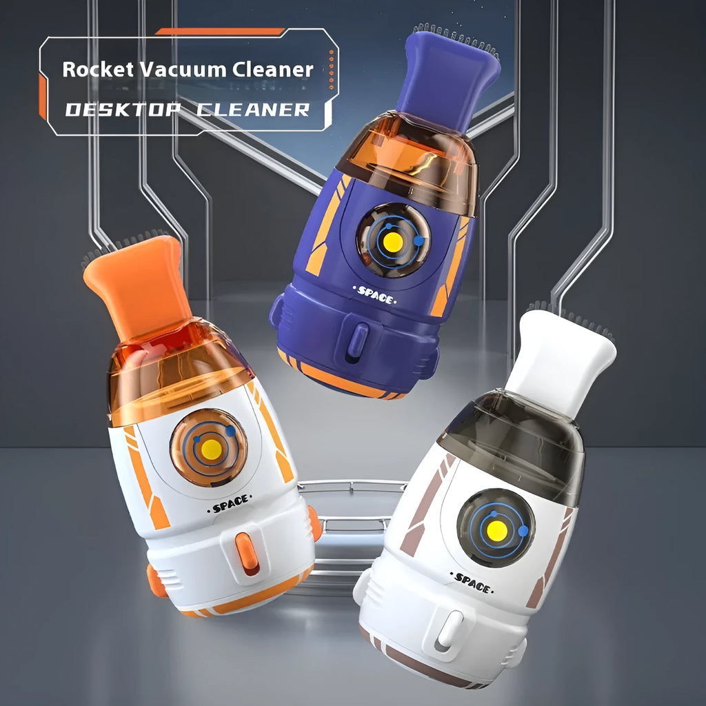 Handheld USB desktop vacuum cleaner in blue rocket design on a wooden desk.