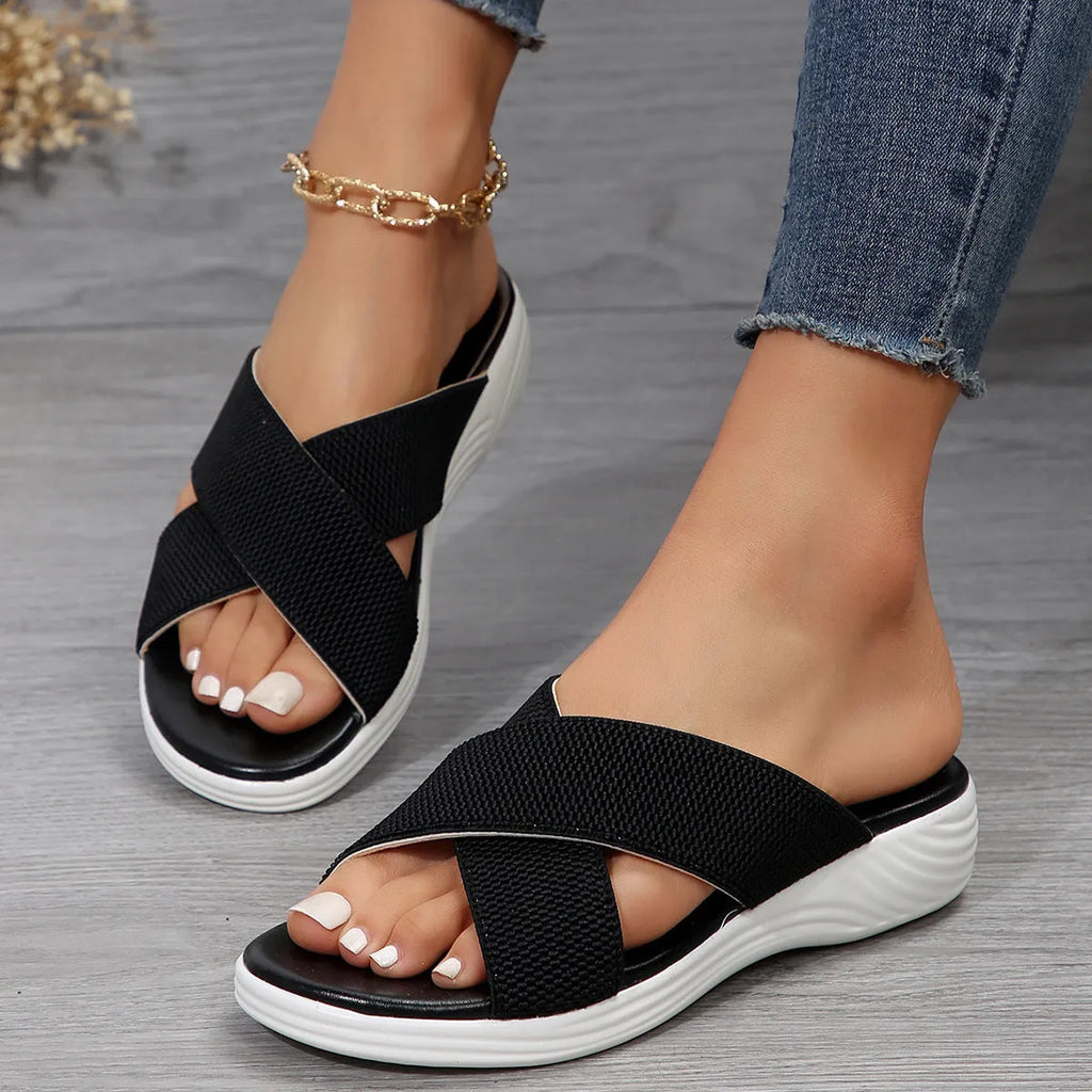 Women's black wedge slippers with cross strap and peep toe fish mouth design