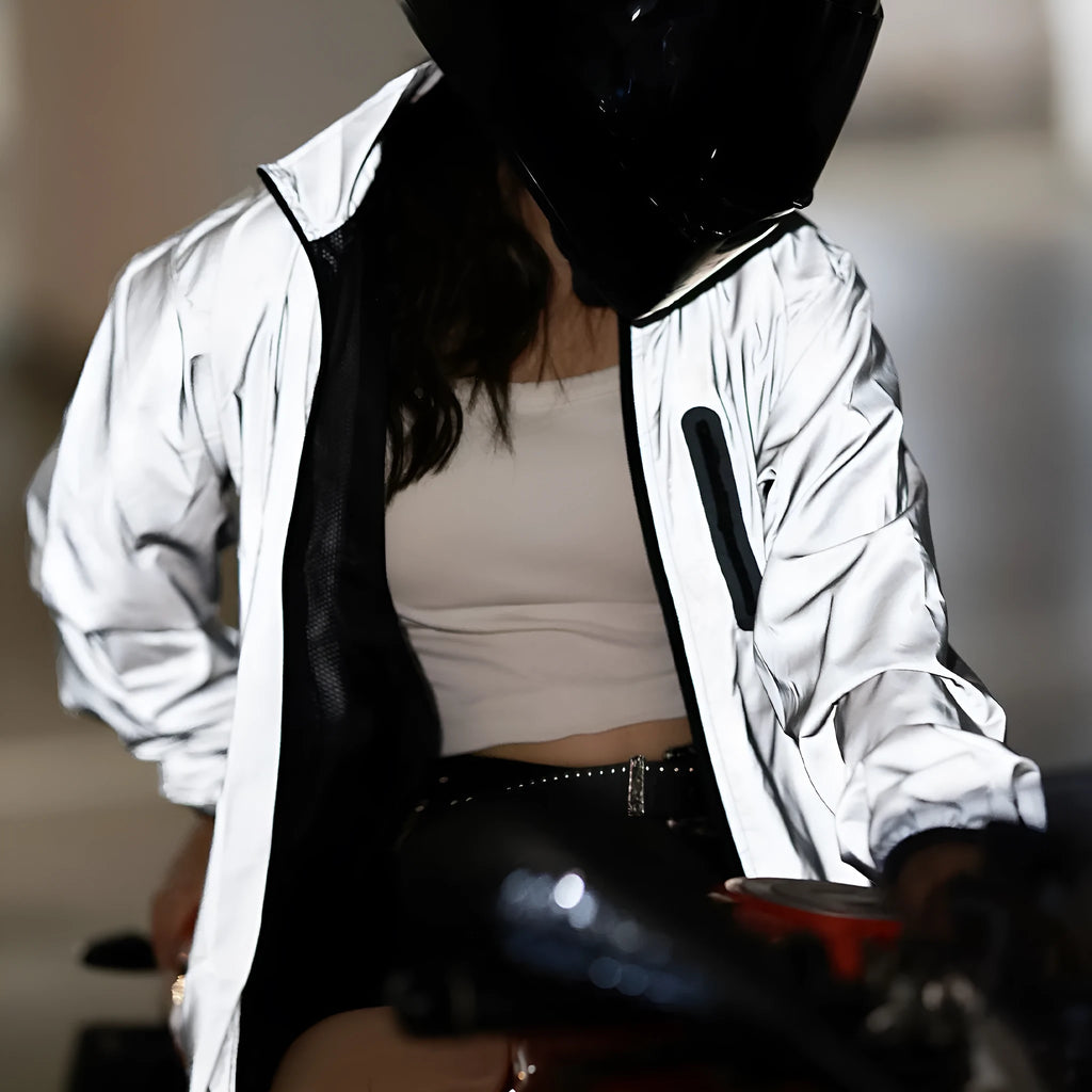 Silver coloured waterproof polyester long sleeve jacket for men on a hanger.