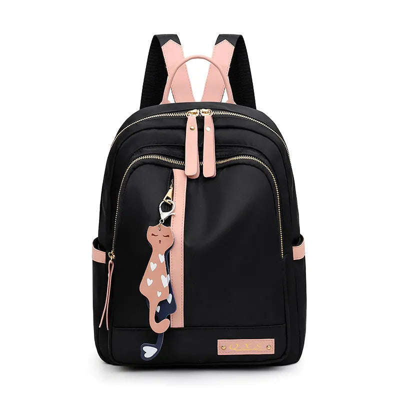 Black women's casual nylon backpack showing square vertical shape with shoulder straps and external pockets