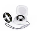 Black ceramic smart ring for heart rate and blood oxygen monitoring on a finger.