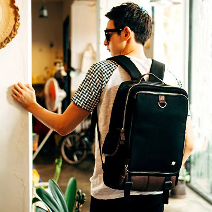 Korean style men's Oxford cloth backpack in seven colour options showing 30x16x46cm dimensions