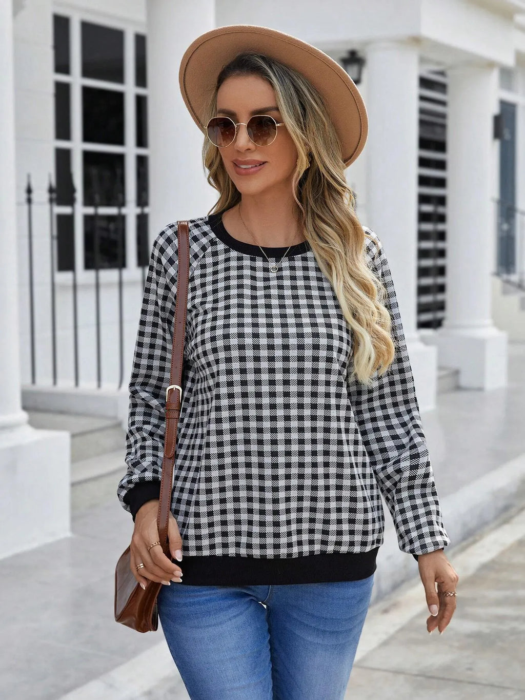Black long sleeve pullover sweater with a Japanese sweet plaid and stripe pattern on a mannequin.