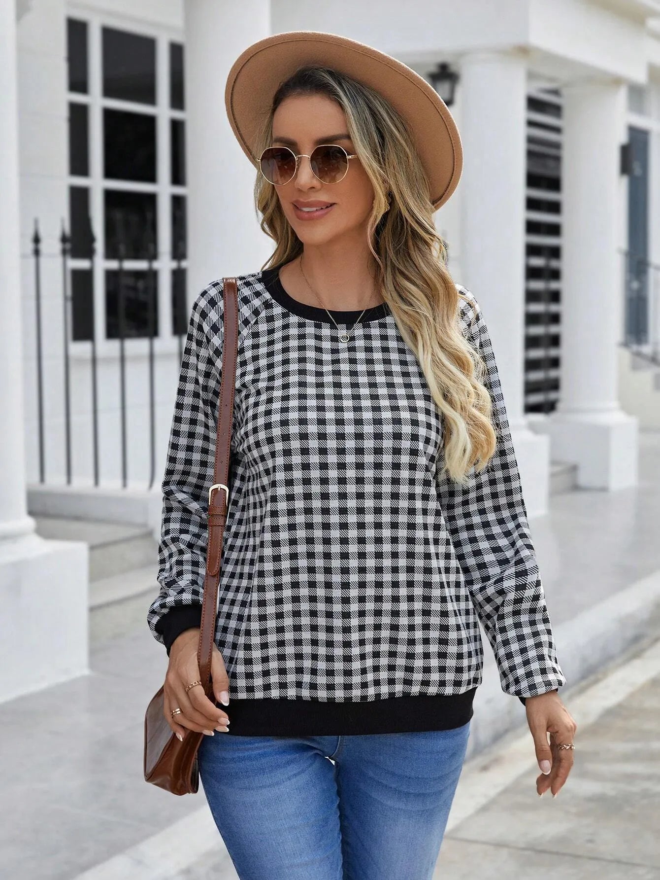 Black long sleeve pullover sweater with a Japanese sweet plaid and stripe pattern on a mannequin.