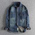 Man wearing a light blue loose-fit vintage denim shirt with long sleeves in a cardigan style.