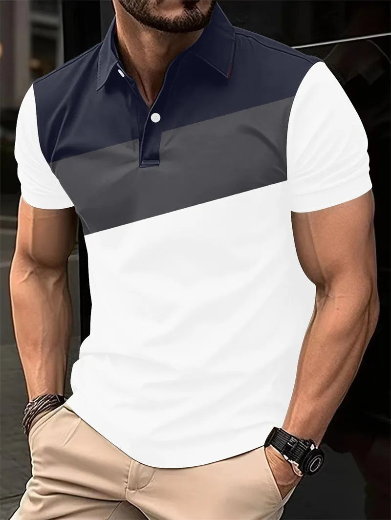 Man wearing a loose fit grey t-shirt with a colourful 3D digital printed abstract pattern on the front.