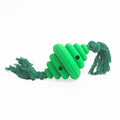 Green and yellow silicone dog ball with attached knot rope toy on grass.