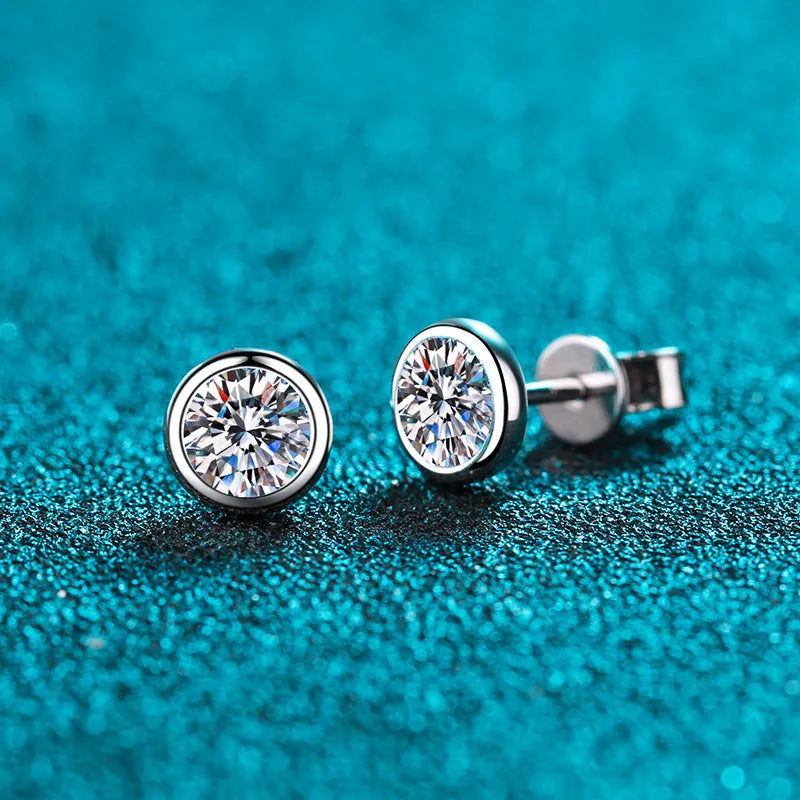 Pair of 925 sterling silver gold plated stud earrings featuring geometric moissanite or zircon stones in golden toad or star shape.
