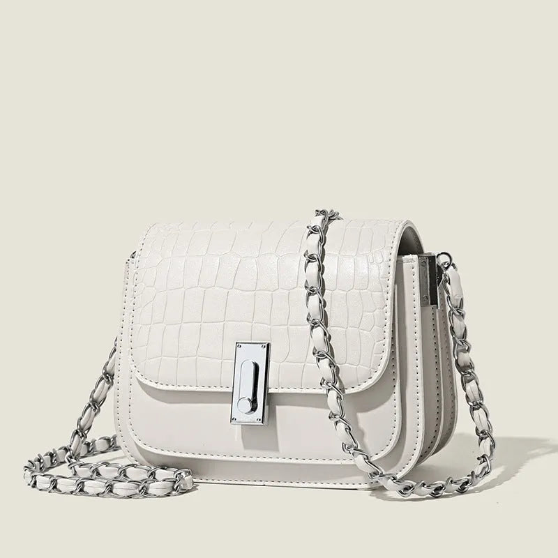 Women's black PU leather chain shoulder bag showing internal phone compartment and sewing thread detailing