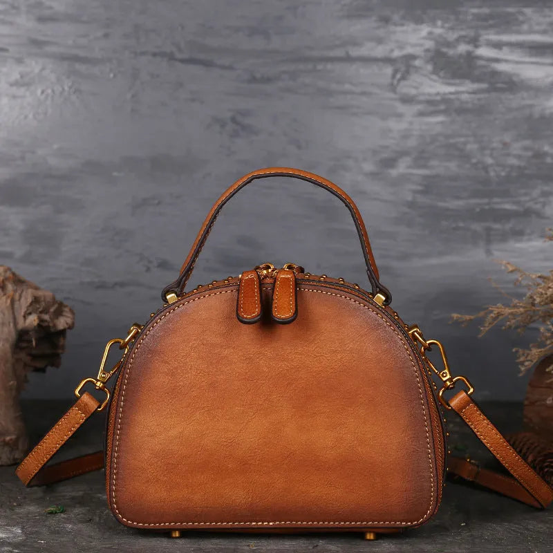 Vintage cowhide suede leather handbag showing internal organisation compartments including ID pouch and mobile phone section
