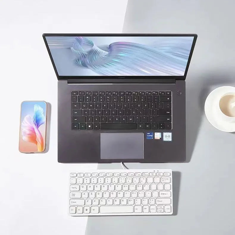 USB wired mini keyboard in black, white, pink or blue colours showing compact size