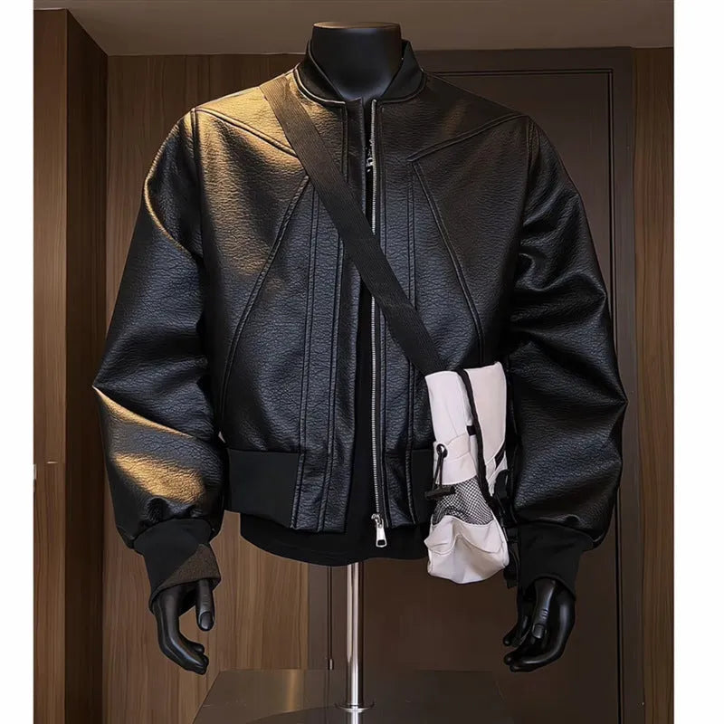 Men's black PU leather jacket with extended length and slim fit design shown from front